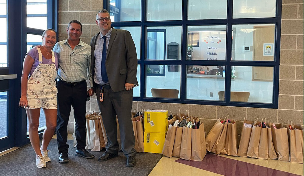 Delivering donated backpacks to local school